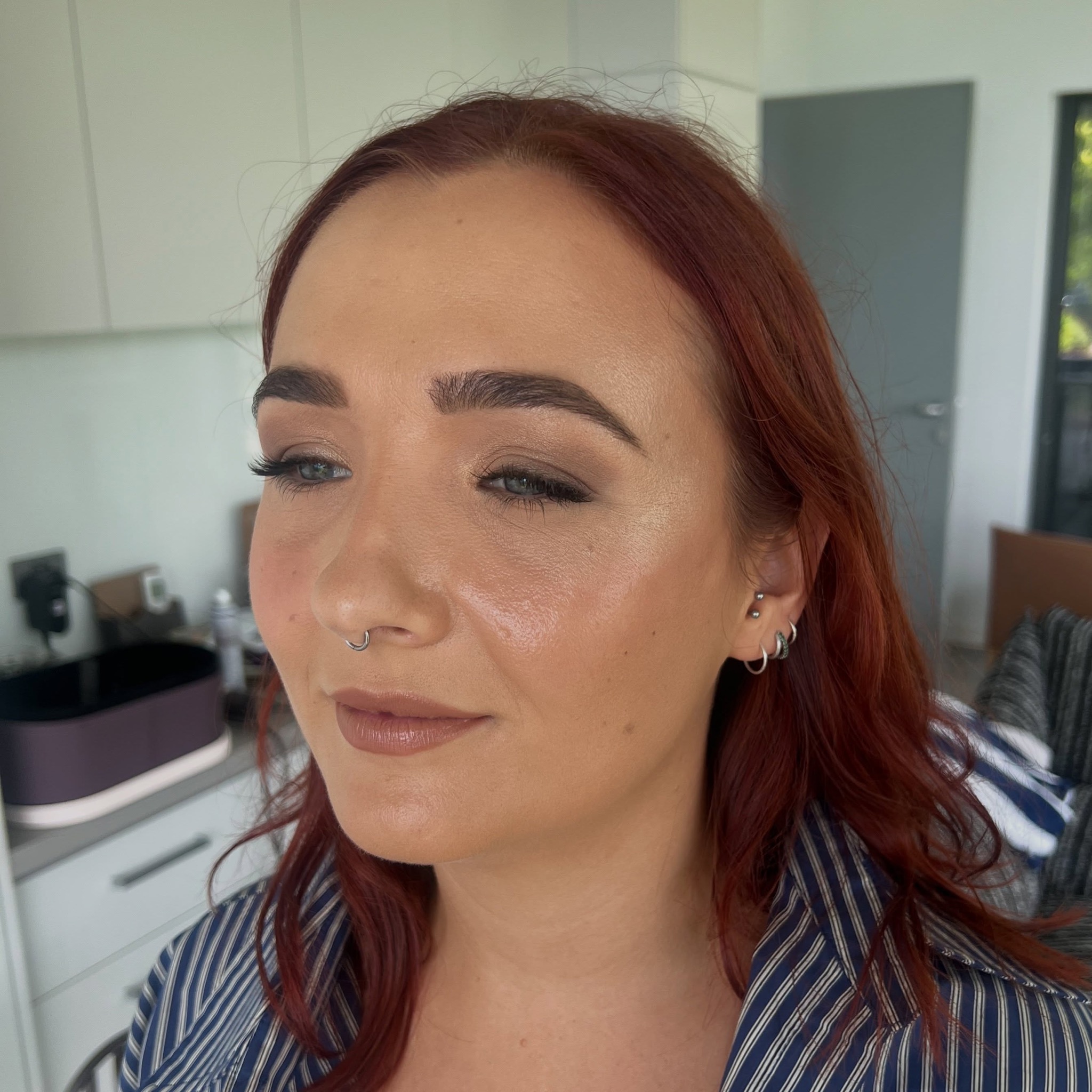 Soft glam makeup on a client with red hair